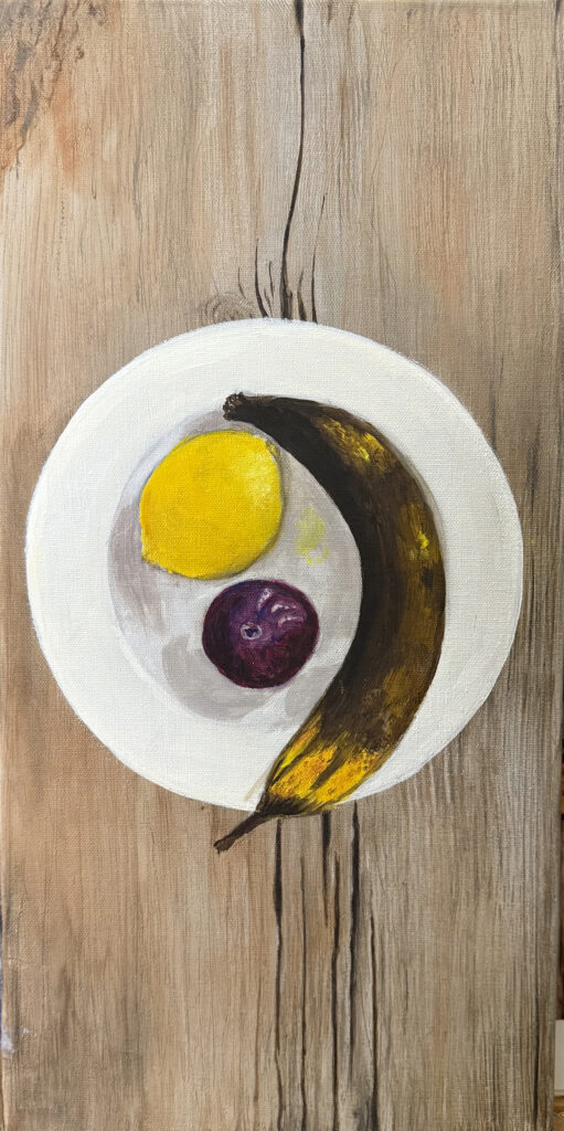 A Maduro, a lemon and a plum nestled in a white shallow ironstone soup bowl. The bowl rests on a weathered wooden board. All of this illusion made with paint and canvas.